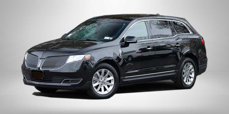 Lincoln MKT: Black Sedan, seats 3, 4 suitcases
